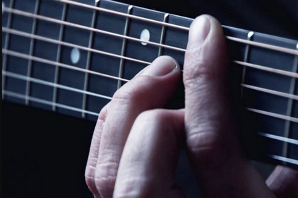 hands playing guitar